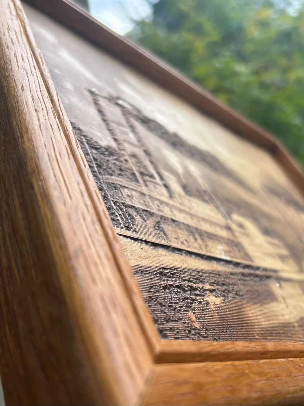 vintage wood-burned or engraved art titled 